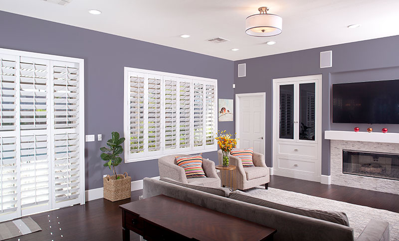 Purple painted living room with plantation shutters